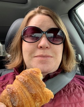 Ann Bunger in sunglasses with delicious croissant